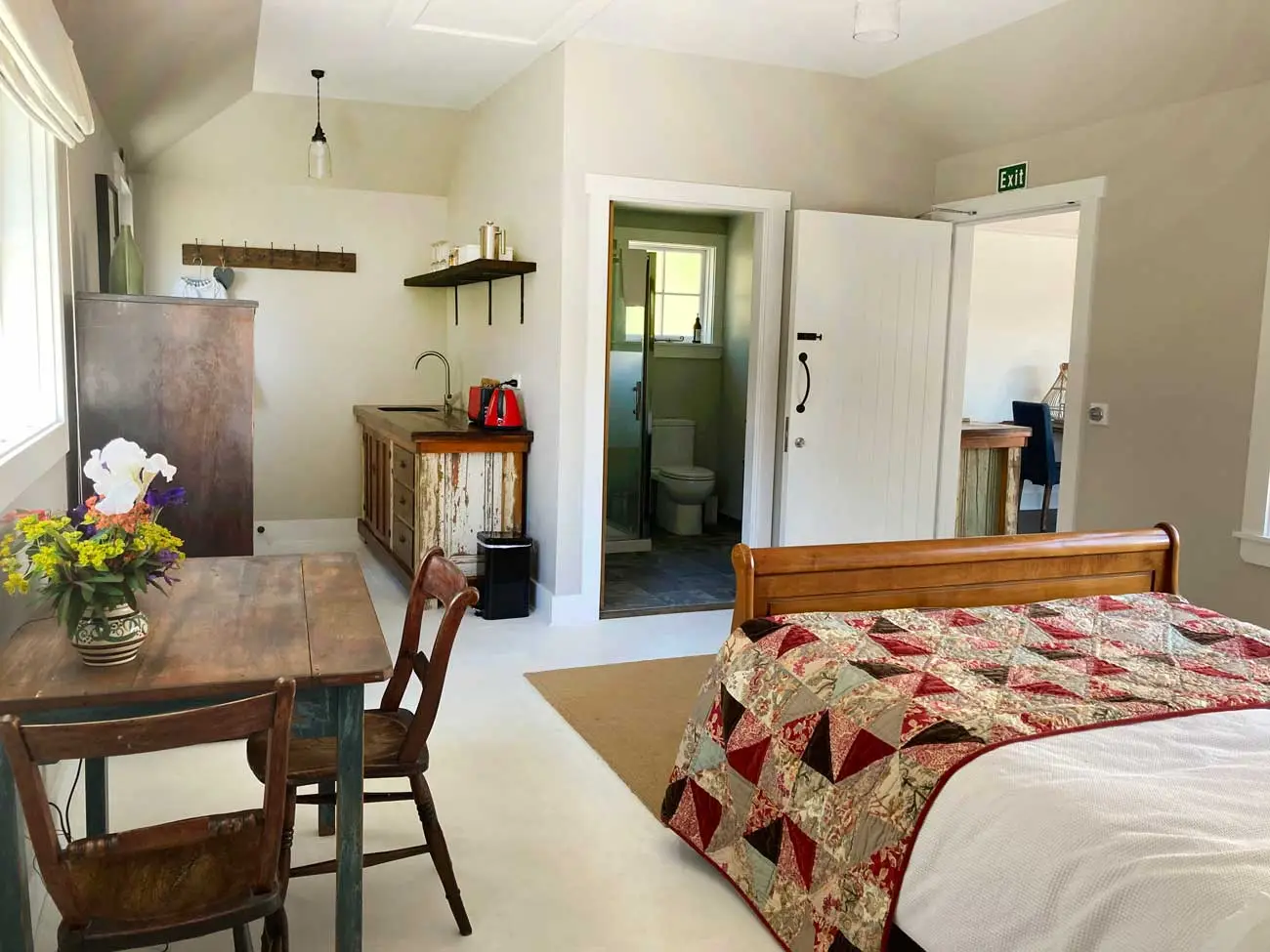 East Wing interior at The Red Barns B&B, Tai Tapu, Canterbury, New Zealand, showing kitchen and bathroom area with interconnecting door to West Wing, ideal Christchurch and Selwyn accommodation